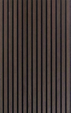 the side of a wooden wall with vertical slats in brown and black woodgrain