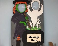 a halloween door hanger with a witch holding a broom and a ghost in a cauldster