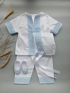 Nice christening white baby boy suit with the blue cotton lace.  Made from soft pure polished cotton and cotton lace. It looks very nice and glitters elegantly.  The photo of the boy in the same suit but with other kind of lace i is to demonstrate how the suit could fit.  This outfit, suit, hat,  and booties have blue lace.  The outfit includes a shirt and pants.  Booties, hats are available to add in the Set option.  The personalization embroidery could be on booties, and shirt.  - 100% Fine Cotton Fabric - 100% Cotton Blue Lace - White Color - Set of SKU is Optional (please choose one at the SET option on this page) Size Chart for child's height: Suit Preemie           50 - 56 cm    19.68 - 22.04 inches  Newborn          56 - 62 cm     22.04 - 24.40 inches 0-3 months      62 - 68 cm White Cotton Sets For Baptism, Cotton Baptism Sets, White Cotton Baptism Sets, Elegant Blue Sets For Baptism, Baptism Boy Outfit, Meme Costume, Outfit Suit, Suit Hat