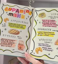 a person holding up an open menu book with different types of food on the pages