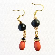 Introducing our exquisite handmade beaded earrings, crafted with vintage hand painted wooden beads and 18K gold plated sterling silver components. These earrings are a true work of art, designed to bring a touch of elegance to any outfit. Each earring features a unique combination of colorful glass beads, hand-selected for their beauty and quality. The beadwork is expertly crafted to create a stunning pattern that catches the light and sparkles with every movement. The gold plated sterling silver components add a touch of luxury to the earrings, ensuring they will last for years to come. The ear wires are also made of sterling silver, making them safe for even the most sensitive ears. These beaded earrings are perfect for any occasion, from a night out with friends to a formal event. They Adjustable Wooden Beaded Earrings As Gift, Gift Wooden Beaded Earrings, Wooden Beads Round Beaded Earrings As Gift, Gift Wooden Beaded Round Earrings, Traditional Adjustable Earrings With Wooden Beads, Traditional Adjustable Wooden Bead Earrings, Wooden Beads Dangle Earrings, Wooden Bead Earrings, Handmade Earrings Beaded