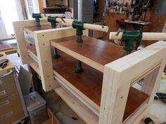 the workbench is being built and ready to be worked on with woodworking tools