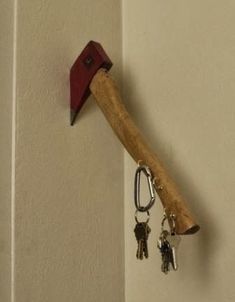 a hammer and keychain hanging on the wall