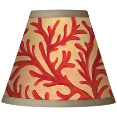 a lamp shade with red coral print on it