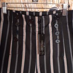 These Has A Button Front A Side Zipper And Clasp On A Striped Background. The Leg Is Slightly Wide And It Is A Size Medium. They Are Nwtags. Elegant Striped Bottoms For Night Out, Summer Business Casual Pants With Buttons, Business Casual Summer Pants With Buttons, Chic Button-up Bottoms For Formal Occasions, Chic Button-up Formal Bottoms, Black Summer Pants With Button Closure, Chic Pants With Buttons For Night Out, Summer Office Bottoms With Buttons, Chic Button-up Bottoms For Night Out