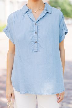 This chambray top is sure to make any outfit super cute! It's such a classic look. This chambray top is going to style easily with white shorts, jeans, or even printed midi skirts! Collared partial button down neckline Short sleeves No stretch Baileigh is wearing the small. Spring Light Wash Denim Top For Everyday, Spring Everyday Light Wash Denim Top, Everyday Spring Denim Top, Summer Denim Collared Shirt, Summer Collared Denim Shirt, Collared Denim Shirt For Summer, Relaxed Fit Light Wash Denim Top For Day Out, Summer Medium Wash Button-up Denim Top, Summer Light Wash Button-up Shirt