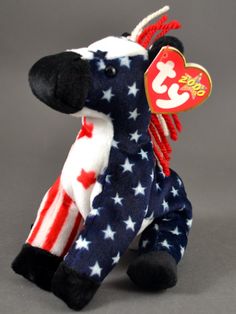 a stuffed toy horse with red, white and blue stars on it's body