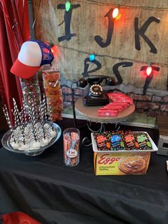 a table topped with candy and candies next to a sign that says i love you