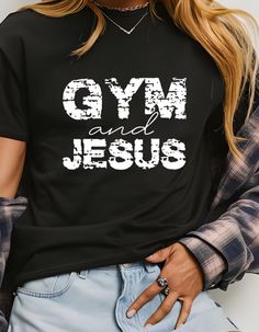 Show your passion for fitness and faith with this bold graphic tee featuring 'Gym & Jesus' in a stylish design. Perfect for workouts, casual wear, or expressing your devotion, this soft, comfortable t-shirt is a great conversation starter and a unique addition to your wardrobe. Stay motivated, both physically and spiritually Comfortable Gym T-shirt With Letter Print, Athleisure T-shirt With Letter Print And Comfortable Fit, Comfortable Athleisure T-shirt With Letter Print, Comfortable Athleisure Letter Print T-shirt, Slogan T-shirt For Workout Athleisure, Athleisure Slogan Workout T-shirt, Graphic Print Activewear For Workout, Comfortable Graphic Print Activewear For Workout, Comfortable Pre-shrunk Workout T-shirt