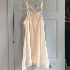 New With Tags! I Purchased This From Another Posher And It Doesn't Fit As I Want It To. The Dress Is Beautiful With Detailed Off White Lace And Croquet. Crossed Spaghetti Straps. Higher On The Sides Than Middle At The Bottom Hem. Built In Slip As Seen. Feel Free To Make An Offer Or Ask Any Questions! Measurements: About 33.5 In Length (Top Of Strap To Bottom) Armpit To Bottom Is 22in Delicate, Vintage Look, Layer, Summer, Beach, Boho, Bohemian, Hippie, Coachella, Woodstock Lace Crochet Trim Sundress, Lace Crochet Sundress With Crochet Trim, Lace Crochet Sundress With Lace Trim, Crochet Lace Sundress With Lace Trim, Summer Lace Mini Dress With Crochet Trim, Spring Day Out Dresses With Crochet Lace, Spring Day-out Dresses With Crochet Lace, Spring Lace Crochet Sundress, Cream Lace Crochet Dress For Spring