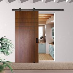 an open sliding door in a kitchen next to a potted plant