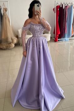 Experience elegance and glamour with our Purple Off The Shoulder Long Sleeve A-Line Prom Dress. With intricate rhinestone and bead detailing, you'll shine like a star in any event. The off-the-shoulder design adds a touch of sophistication, while the A-line silhouette flatters your figure. Perfect for proms and special occasions. Lilac Glitter Dress, Flower Girl Dresses Mermaid, Lilac Glitter, Lilac Prom Dresses, Extravagant Wedding Dresses, Dress With Rhinestones, A Line Prom Dress