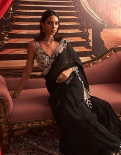 Exude sophistication with this black embellished blouse paired with a pre-draped sari. The intricate embellishments add a touch of glamour, while the pre-draped design ensures effortless elegance, making this ensemble ideal for memorable celebrations and evening events. Pre Draped Saree, Blouse With Tassels, Draped Saree, Drape Saree, Ready To Wear Saree