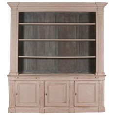 an old white bookcase with doors and drawers on it's sides, isolated against a white background