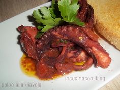 a plate with meat and bread on it