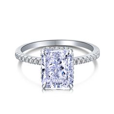 a cushion cut diamond engagement ring with pave set shoulders