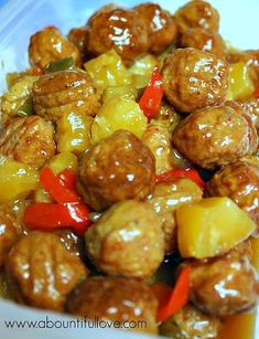 meatballs and pineapples are mixed together in a sauce that is ready to be eaten