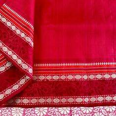 Explore the beauty of traditional handwoven korvai kanjivaram silk saree. Crafted by hand block printed with azo-free dyes, this saree features a white base with pink floral body with red border and pallu. Accented with hand screen print, this elegant piece will make a timeless addition to your wardrobe. Approximate Length 6.5 mtrs (inclusive of blouse length) Approximate Height - 46 - 50" Approximate weight - 1.7 lbs Saree comes with fall, picot and tassels done when applicable. Blouse piece is cut. Kindly Note : The colors you see on your device may vary due to the color reproduction, brightness and resolution of individual devices. If you'd like more clarity before your purchase, please contact our support team. Pink Traditional Wear With Embroidered Border In Cotton Silk, Pink Cotton Silk Dupatta With Embroidered Border, Red Cotton Silk Traditional Wear With Embroidered Border, Red Traditional Wear With Embroidered Border In Cotton Silk, Traditional Red Cotton Silk Wear With Embroidered Border, Red Embroidered Border Chanderi Saree, Red Chanderi Saree With Embroidered Border, Red Anarkali Saree With Embroidered Border, Cotton Silk Dupatta With Border For Traditional Ceremonies