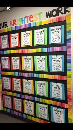 a colorful bulletin board on the wall in an office cubicle that says our brightest work