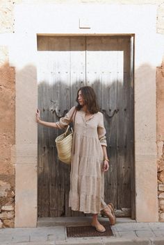 Style // The perfect shade of faded brown linen, for the most beautiful and classic neutral dress Designed to be dressed up or kept cool and casual, this forever timeless maxi dress is the secret to style through every season. Featuring a tiered skirt detail, mother of pearl buttons down the front, and elastic sleeves for added shape and practicality. A true goes with everything essential for every wardrobe Fabric Note // Made in Italy from 100% Linen Sizing Advice // Available in one size, the Tiered Linen Maxi Dress For Vacation, Tiered Beige Maxi Dress For Day Out, Neutral Linen Maxi Dress For Vacation, Spring Bohemian Neutral Maxi Dress, Bohemian Linen Maxi Dress For Day Out, Bohemian Neutral Maxi Dress For Spring, Spring Neutral Bohemian Maxi Dress, Elegant Neutral Linen Maxi Dress, Brown Linen Maxi Dress For The Beach