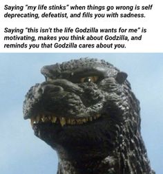 a godzilla statue with the caption saying, saying my life stinks when things go wrong