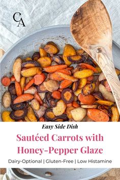 roasted carrots with honey - pepper glaze in a skillet and wooden spoon