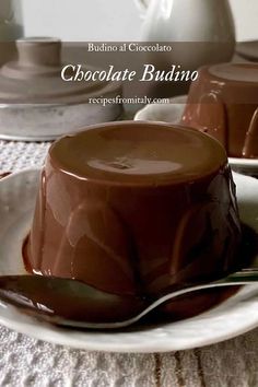 chocolate pudding on a white plate with spoons