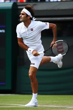 a male tennis player in action on the court