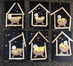 four houses made out of popsicle sticks with pictures of babies in the house on them