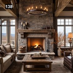 a living room filled with furniture and a fire place in front of a stone fireplace