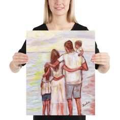 a woman holding up a painting with three people hugging each other on it's face