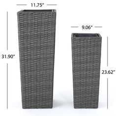 two gray wicker vases sitting next to each other on top of a white background