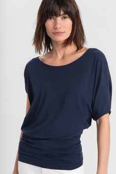 "The Elena Top is a draped dream. She features an off-center scoop neck and asymmetric sleeves with a batwing on one side while extending down effortlessly to hug your hips. Fashioned from our silky-soft, eco-friendly European jersey, Elena's ideal for all day wear and versatile enough for professional or casual. Tuck her in to create a sleek look or wear her out to show off the unique silhouette. GET THE LOOK Top: this listing Pants: Madewell | https://etsy.me/33FtwlX Shoes: https://etsy.me/3hv Batwing Shirt, Minimalist Blouse, Scoop Neck Blouse, Night Tops, Scoop Neck Blouses, In The Mood, Off Shoulder Tops, Sleek Look, Batwing Sleeve