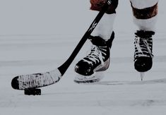 an ice hockey player is skating on the ice