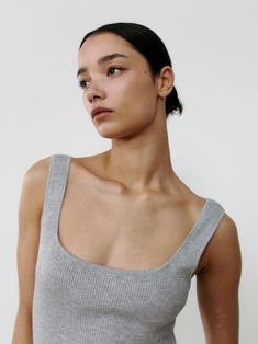 Introducing our newest sleeveless staple, presented in our favourite neutral hues. The gently squared neckline lends an elegant touch, while the ribbed silk and cashmere blend exudes luxury. With a subtle stretch and slim fit, this piece effortlessly elevates any outfit. Squared Neckline, Silk Tank, Cashmere, Slim Fit, Silk