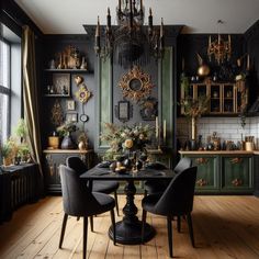 an elegant dining room with black walls and wooden flooring, chandelier hanging from the ceiling