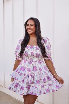 Gorgeous floral print dress featuring a pink floral print throughout, square neckline, puff sleeves with ties, smocked bodice, and a tiered ruffle hemline! Back zipper fully lined, 100% cotton model is 5'4 with a 34"bust and is wearing a small runs true to size 0-4 S, 6-8 M, 10-12 L Pink Floral Print, Smocked Dress, Square Necklines, Spring Dresses, Floral Print Dress, Ruffle Dress, Square Neckline