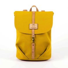 a yellow backpack is shown with straps on the front and back ends, which are attached to