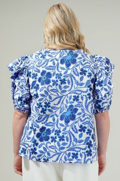 The Celeste Floral Poplin Ruffle Short Sleeve Top is the perfect top to wear out for your next brunch date or any event! It has a divine blue and white floral design print. Soft, cotton lightweight fabric, creates a keyhole neckline, and ruffle, puff half sleeves. Relaxed bodice features a poplin top to add details. Pair it with a please midi skirt for the ultimate look!- Puffed short sleeves- Keyhole- Ruffle detail- Cotton- Color: White Blue ComboSize + Fit - Model is 5'9" and wearing size 2X- Cotton Ruffle Sleeve Tops With Floral Print, Cotton Top With Floral Print And Ruffle Sleeves, Cotton Tops With Ruffle Sleeves And Floral Print, Cotton Tops With Floral Print And Ruffle Sleeves, Floral Print Flutter Sleeve Tops For Brunch, Flutter Sleeve Floral Print Top For Brunch, Cotton Blouse With Floral Print And Ruffle Sleeves, Garden Party Tops With Flutter Sleeves And Floral Print, Printed Cotton Blouse With Ruffle Sleeves