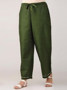 Green cotton satin pants with drawstring at waist and pockets. Features: Fabric-cotton satin Waist with drawstrings Highlight piping Handmade in India Garment measurements (in Inches): Size XS : Waist-26", Length-37" Size S : Waist-28", Length-37" Size M : Waist-30", Length-37" Size L : Waist-32", Length-37" Size XL : Waist-34", Length-37" Size XXL : Waist-36", Length-37" Size 3XL : Waist-38", Length-37" Size 4XL : Waist-40", Length-37" Fit: Model height - 5"7" Model is wearing a size S Fit - co Designers Dresses, The Secret Label, Ladies Pants, Dress Indian, Satin Pants, Dress Indian Style, Indian Style, Green Cotton, Fashion Designers