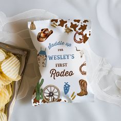 some chips are laying on top of a white sheet with the words saddle up for westley's first rodeo