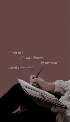 a person writing on a notebook with a pen in their hand and the quote you are the last dream of my soul