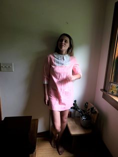 Up for sale is a vintage 1960's to 1970's striped, collared dress in pink and white, approximately size S. Overall the garment is in great condition for its age though it does have various wear present, such as minor spots of discoloration (see photos). There is a little tear on the back collar but it cannot be seen when worn owing to the collar being folded over. Most of the discoloration can be seen on the white trim/accents. Despite the minor flaws, this is a beautiful piece with many years o Cotton Short Sleeve Dress With Striped Collar, Pink Long Sleeve Vintage Dress For Summer, Pink Fitted Casual Vintage Dress, Cotton Collared Dress With Striped Collar, Pink Collared Cotton Dress, Pink Cotton Collared Dress, Casual Pink Vintage Dress For Spring, Pink Retro Dress With Peter Pan Collar, Pink Collared Dresses For Spring