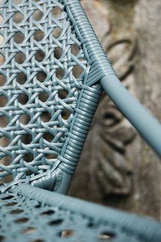 a close up view of a blue metal chair