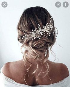 a woman wearing a bridal hair comb