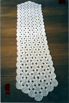 a white doily on a wooden table