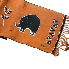 an elephant is shown on a brown blanket