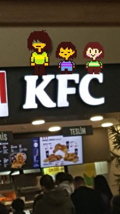 people are standing in front of the kfc sign