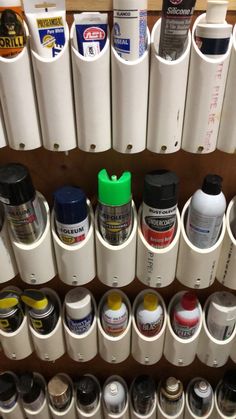 many different types of paint are lined up on the wall