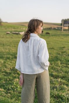 "An Oversized Linen Shirt is for sure a wardrobe staple for all times. Classic modest style is moderately embellished with stylish patch pockets. This white button up shirt can be favorably combined both with loose and classic bottoms. A slightly cropped design delicately hints at the waistline. Thus, it creates a perfect balance to a current-day trend on oversized clothes. DETAILS ⚬ Spread collar. ⚬ Patch pockets are decorated with handmade fancy stitches. ⚬ Button fastening. ⚬ 3/4 sleeve. ⚬ Sl Clothes Details, Oversized Linen Shirt, White Button Up Shirt, Oversized Clothes, Modest Style, White Linen Shirt, White Button Up, Shirt Button, Custom Tailoring